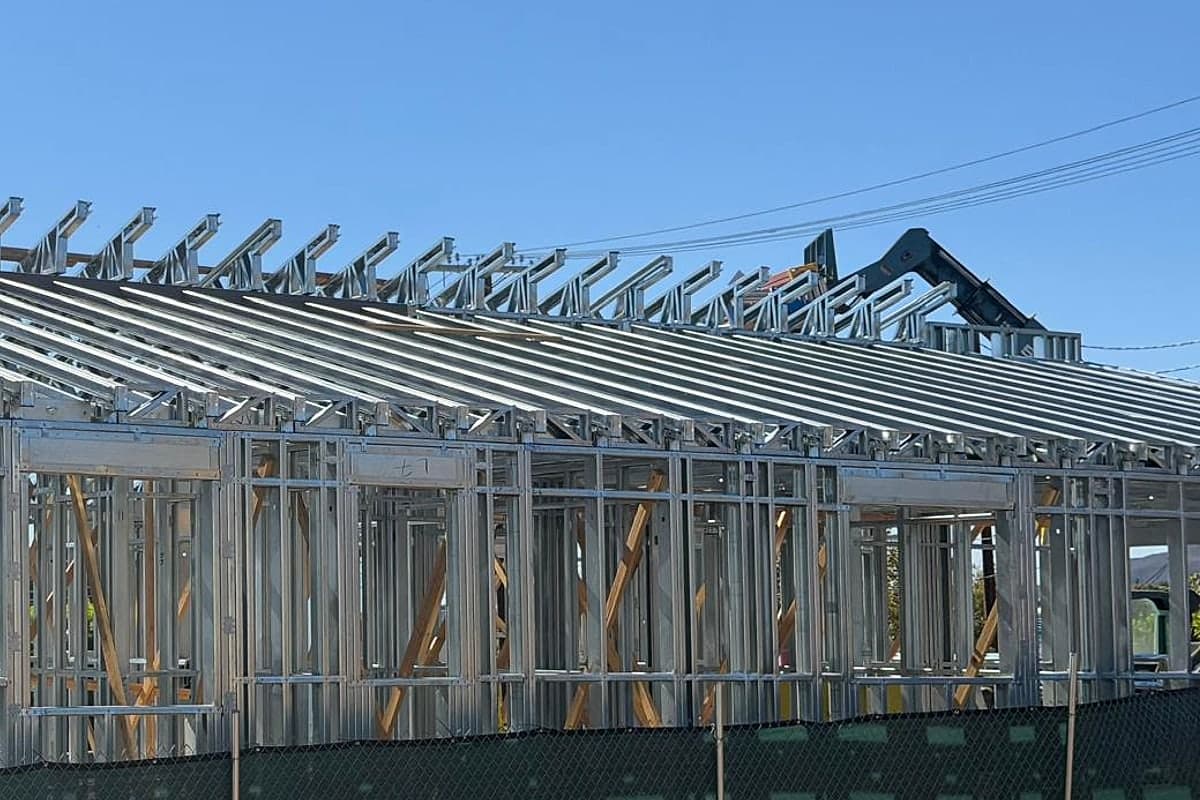 Steel rafters running the full length of the roof over light-gauge steel walls