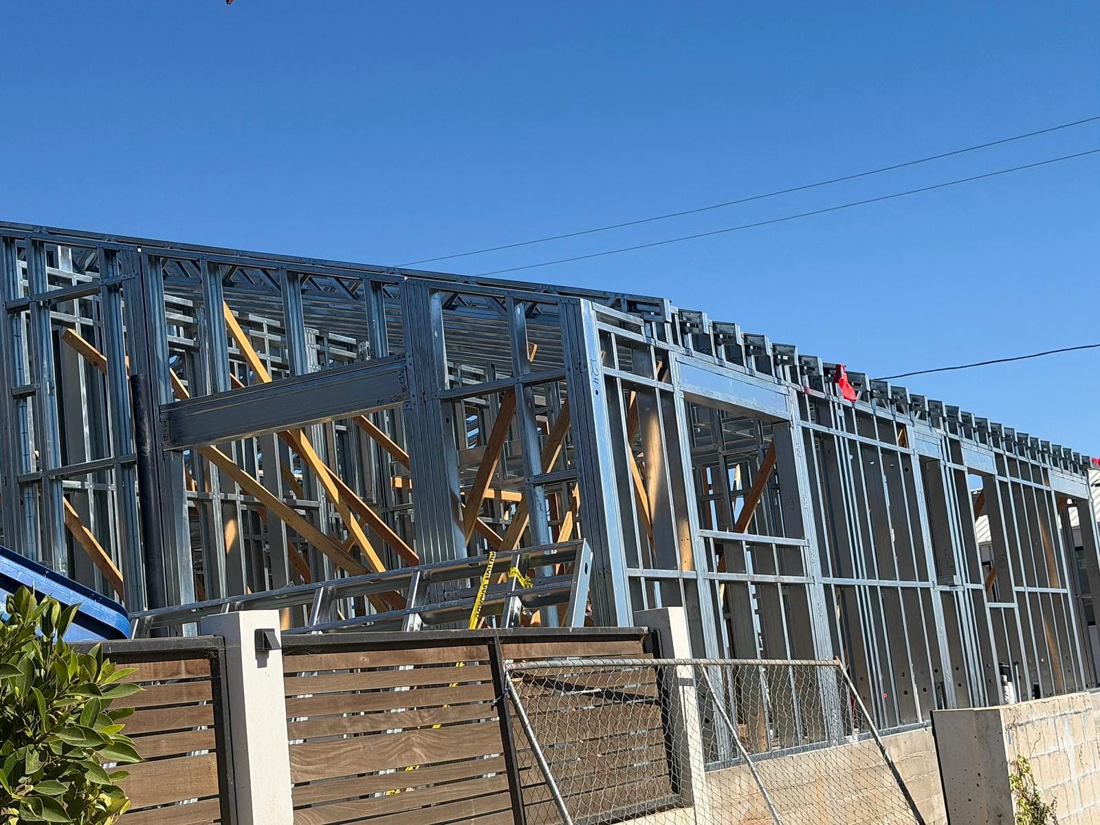 Street-side elevation of the steel-framed house with window openings, headers and the roof framing along the top